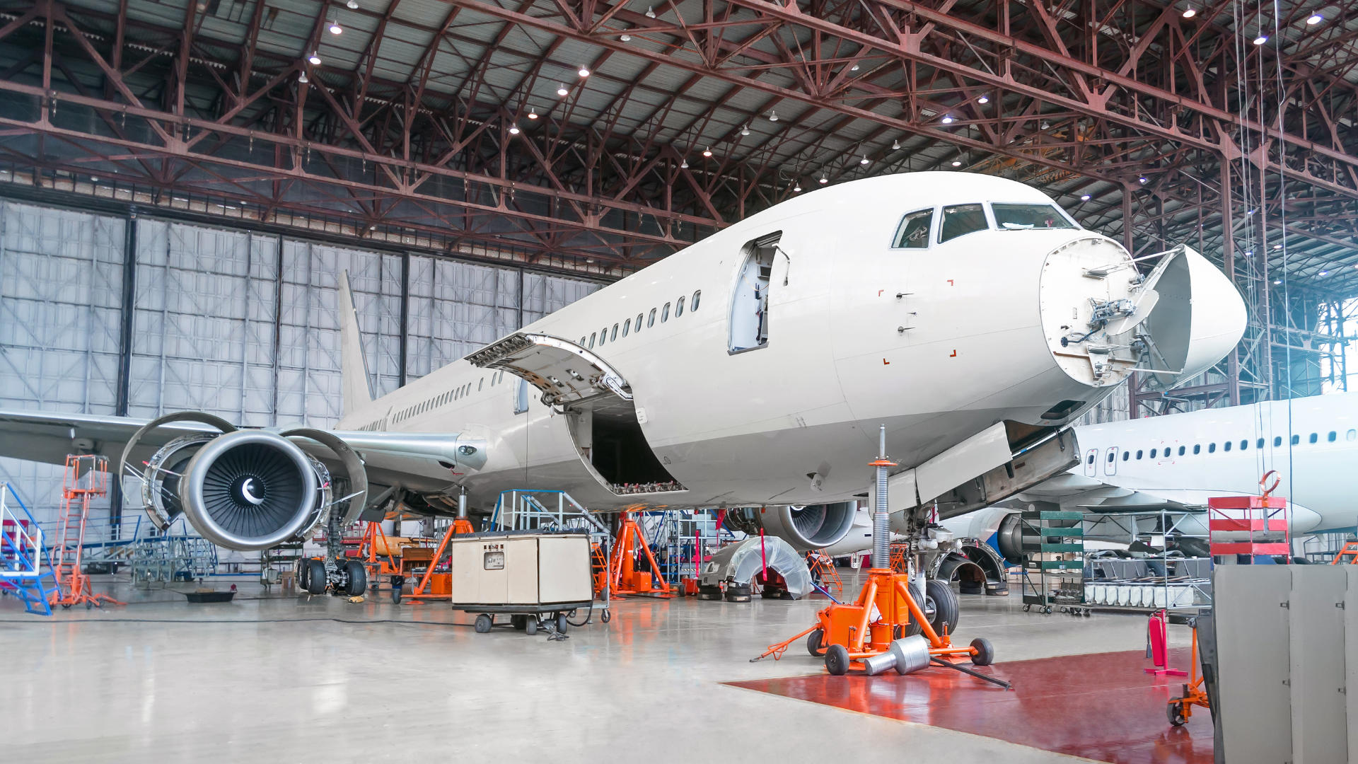 An aeroplane in an indoor warehouse space